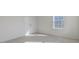 Bedroom with plush carpeting, closet, and large window at 2322 Sugar Cone Way, Fuquay Varina, NC 27526