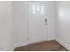 Bright entryway featuring a white door, modern lockset, and wood-look flooring at 2322 Sugar Cone Way, Fuquay Varina, NC 27526