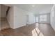 Spacious living room with wood-look flooring and plenty of natural light at 2322 Sugar Cone Way, Fuquay Varina, NC 27526