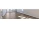 Sunlight streams into this spacious living room, featuring wide plank floors and neutral walls at 2322 Sugar Cone Way, Fuquay Varina, NC 27526