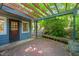 Back porch with wooden pergola and wood decking with a seating bench offers a unique space to relax at 2417 Lawrence Dr, Raleigh, NC 27603