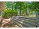Backyard deck with multi level stairs and brick patio offers relaxation outdoors at 2417 Lawrence Dr, Raleigh, NC 27603