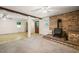 This basement has a wood-burning stove, carpet, and convenient access to a bathroom at 2417 Lawrence Dr, Raleigh, NC 27603