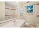 Bathroom features a large mirror, vanity with sink, and window for natural light at 2417 Lawrence Dr, Raleigh, NC 27603