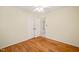 Bedroom with wood floors and a double door closet at 2417 Lawrence Dr, Raleigh, NC 27603