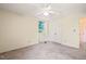 Bedroom featuring neutral carpet, natural lighting, and a double door closet at 2417 Lawrence Dr, Raleigh, NC 27603