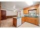 Traditional kitchen featuring light wood cabinets and a breakfast bar that opens to dining area at 2417 Lawrence Dr, Raleigh, NC 27603