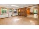Cozy living area featuring a brick wall and access to an adjacent room at 2417 Lawrence Dr, Raleigh, NC 27603