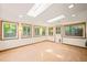 Well-lit living room with skylights and large windows, providing ample natural light at 2417 Lawrence Dr, Raleigh, NC 27603