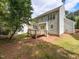Exterior view of the home's backyard with a deck, patio and sliding glass door at 2424 Horizon Hike Ct, Raleigh, NC 27603