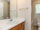 Bright bathroom featuring a white sink, mirror, and a combined shower and tub at 2424 Horizon Hike Ct, Raleigh, NC 27603