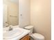 Half bathroom featuring a vanity with a wood cabinet and a toilet at 2424 Horizon Hike Ct, Raleigh, NC 27603