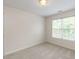 Bright bedroom features neutral walls, carpeting, and a large window, creating a cozy and inviting atmosphere at 2424 Horizon Hike Ct, Raleigh, NC 27603