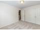 Bedroom featuring neutral walls, carpeting, and a view of an open bathroom doorway and a closet at 2424 Horizon Hike Ct, Raleigh, NC 27603