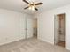 Bedroom featuring neutral walls, carpeting, closet, and view of open bathroom and staircase at 2424 Horizon Hike Ct, Raleigh, NC 27603