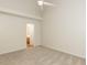 Bright bedroom features neutral walls, carpeting, and ceiling fan, creating a serene and inviting atmosphere at 2424 Horizon Hike Ct, Raleigh, NC 27603