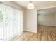 Bright dining area featuring a sliding glass door and hardwood floors at 2424 Horizon Hike Ct, Raleigh, NC 27603