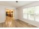 Open dining area with hardwood floors leading to the kitchen at 2424 Horizon Hike Ct, Raleigh, NC 27603