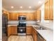 Well-equipped kitchen featuring stainless steel appliances and wood cabinetry at 2424 Horizon Hike Ct, Raleigh, NC 27603