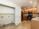 Kitchen featuring wood cabinets and new appliances next to the pantry at 2424 Horizon Hike Ct, Raleigh, NC 27603