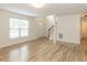 Bright living room with hardwood floors and a staircase at 2424 Horizon Hike Ct, Raleigh, NC 27603
