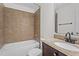 A well-lit bathroom features a tub-shower combo and a granite countertop sink at 2941 Golden Oak Ct Ct, Raleigh, NC 27603