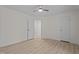 A brightly lit bedroom boasts light wood floors and ceiling fan and neutral walls at 2941 Golden Oak Ct Ct, Raleigh, NC 27603