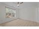 Bright bedroom with a ceiling fan, large window, and wood-look flooring at 2941 Golden Oak Ct Ct, Raleigh, NC 27603