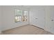 A well-lit bedroom featuring wood floors, a window, and a closet for storage at 2941 Golden Oak Ct Ct, Raleigh, NC 27603