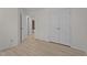Bedroom with wood floors that leads into bathroom and large storage closet at 2941 Golden Oak Ct Ct, Raleigh, NC 27603