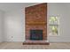 Brick fireplace with wooden mantle at 2941 Golden Oak Ct Ct, Raleigh, NC 27603