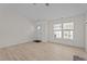 Open-concept living room with new floors, a front door and plenty of natural light at 2941 Golden Oak Ct Ct, Raleigh, NC 27603