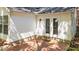 Charming brick patio with white siding and glass patio doors offers a cozy outdoor space at 2941 Golden Oak Ct Ct, Raleigh, NC 27603