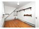 Attic with hardwood floors, a small window, and built-in shelving at 305 N Ellis Ave, Dunn, NC 28334