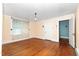 Bedroom with hardwood floors, trim, and a view to another room at 305 N Ellis Ave, Dunn, NC 28334