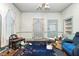 Traditional living room with patterned carpet, overhead fan, and traditional features at 305 N Ellis Ave, Dunn, NC 28334