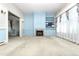 Bright living room features a fireplace, built-in shelves, and large window overlooking the yard at 305 N Ellis Ave, Dunn, NC 28334