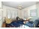 Traditional living room with patterned carpet, overhead fan, and traditional features at 305 N Ellis Ave, Dunn, NC 28334