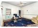 Traditional living room with patterned carpet, overhead fan, and traditional features at 305 N Ellis Ave, Dunn, NC 28334
