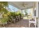 Covered porch with brick flooring, swing, and outdoor seating at 305 N Ellis Ave, Dunn, NC 28334