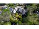 An aerial view highlighting a home with a beautiful garden, surrounded by mature trees and other houses at 315 Oakwood Ave, Raleigh, NC 27601