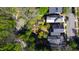 An aerial view showcases a lush backyard, complete with a garden and mature trees, in a residential neighborhood at 315 Oakwood Ave, Raleigh, NC 27601