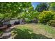 Backyard features a brick patio, lush plants and greenery creating a serene outdoor space for relaxing and entertaining at 315 Oakwood Ave, Raleigh, NC 27601