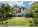 Expansive backyard featuring a lush lawn, patio, and garden, ideal for outdoor living at 315 Oakwood Ave, Raleigh, NC 27601