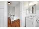 Well-lit bathroom features a white vanity with marble countertop and subway tile walls at 315 Oakwood Ave, Raleigh, NC 27601