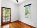 Bright bedroom boasts natural light from the French door and window overlooking the neighborhood at 315 Oakwood Ave, Raleigh, NC 27601