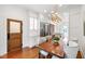 Dining room featuring an industrial style wood table with a decorative light fixture at 315 Oakwood Ave, Raleigh, NC 27601