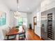 Bright dining area with wood table, elegant chandelier, and modern stainless steel fridge at 315 Oakwood Ave, Raleigh, NC 27601