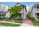 Charming two-story home with covered porches, landscaped yard, and brick driveway at 315 Oakwood Ave, Raleigh, NC 27601