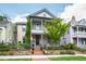 Charming two-story home with covered porches, landscaped yard, and brick pathway creating curb appeal at 315 Oakwood Ave, Raleigh, NC 27601